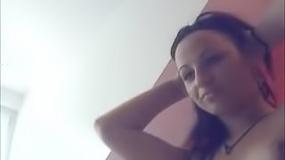 Cute brunette playing with her tits for the webcam