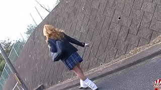 Cock stroking Japanese tranny babe in a pleated skirt