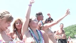 Foxy pornstars enjoy a wild bikini party on the lake