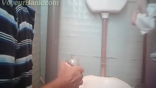 Perverted babe is peeing in the toilet