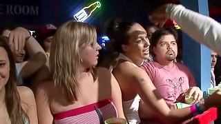 Slutty cowgirl in a revealing miniskirt shows off her nice ass at a wild club party