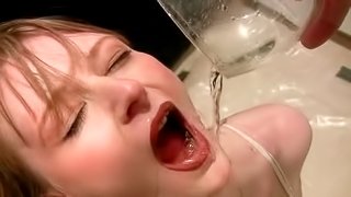 Kinky blonde tramp filling three glasses with her piss