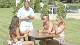 Horny chicks enjoy fucking two guy during a picnic